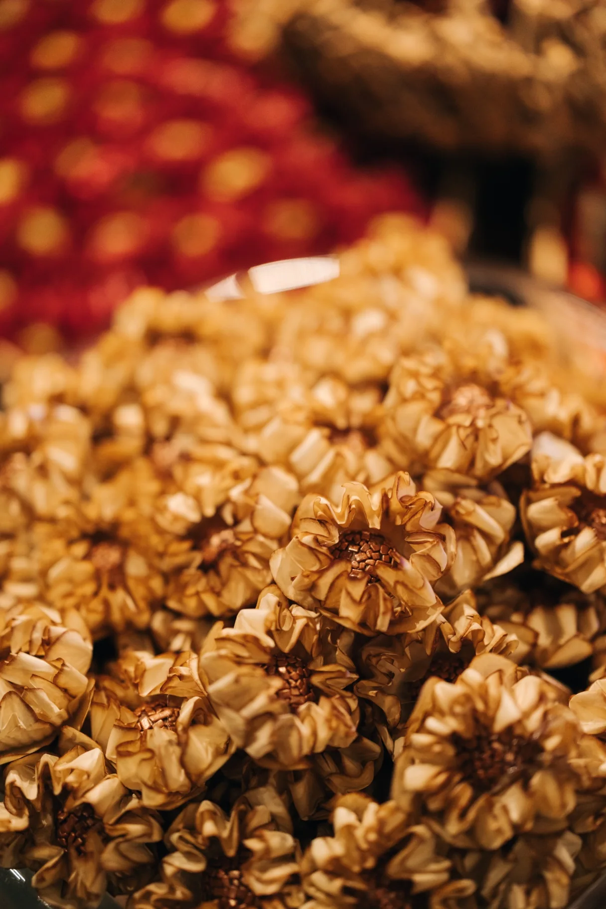 Golden, floral-shaped sweets on the reception table