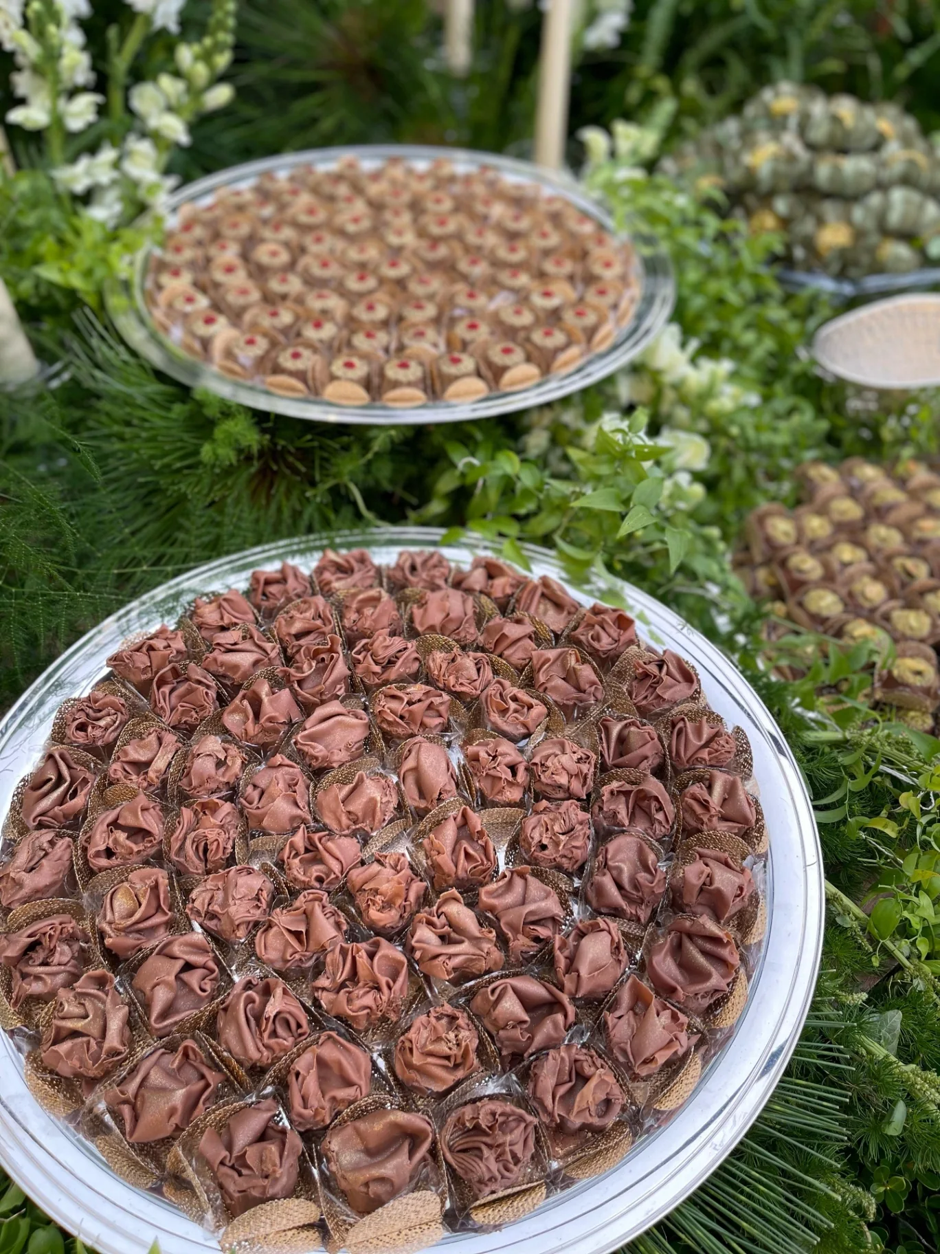 Rose brigadeiros on a crystal platter.