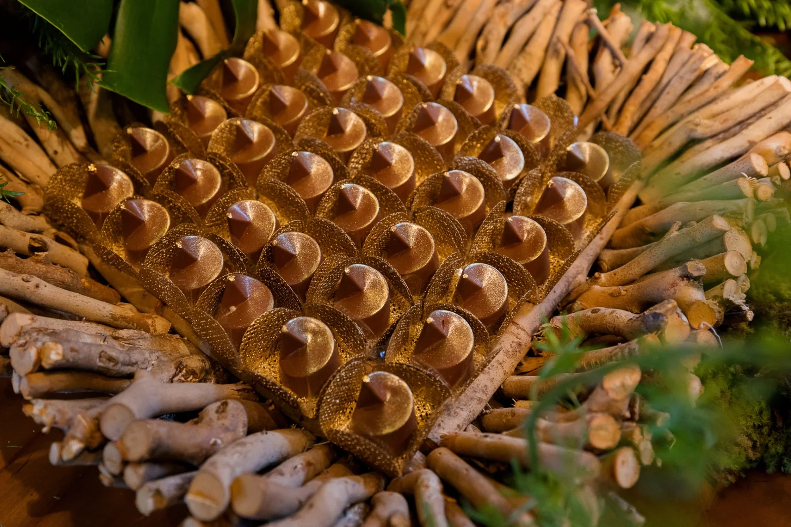 Gilded geometric bonbons in a rustic composition