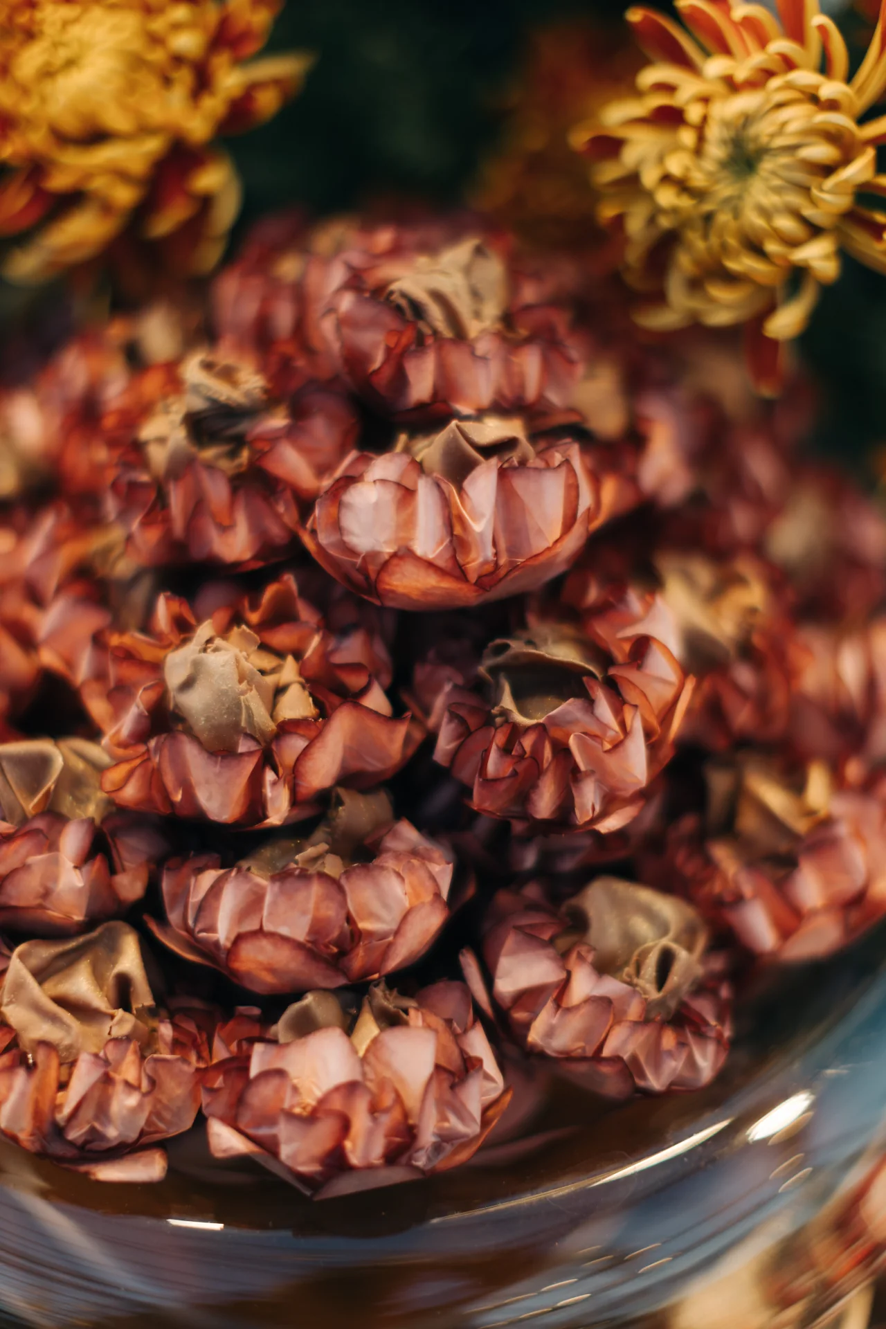 Rosé and gold floral bonbons set among table arrangements